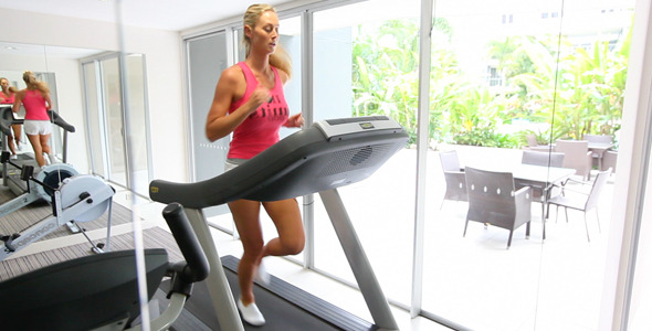 Girl in Gym Running on Treadmill Girl in Gym Running on Treadmill