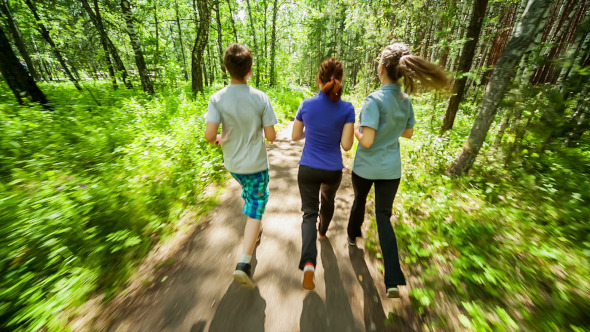 Young People Jogging in Wood Young People Jogging in Wood