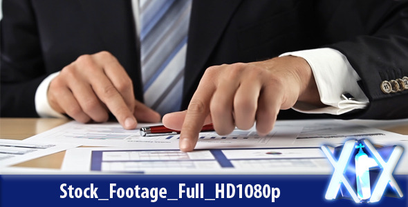 Businessman Analyzing Graphs Businessman Analyzing Graphs