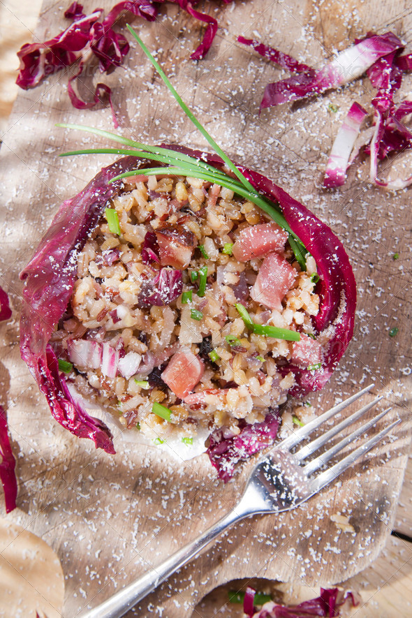 Brown rice with red radicchio and speck
