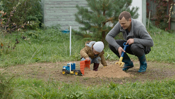 Father And Son Playing Outdoors Father And Son Playing Outdoors