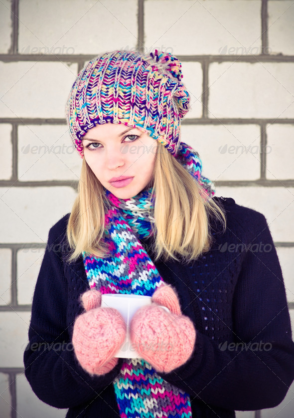Young Woman with coffee cup Winter time