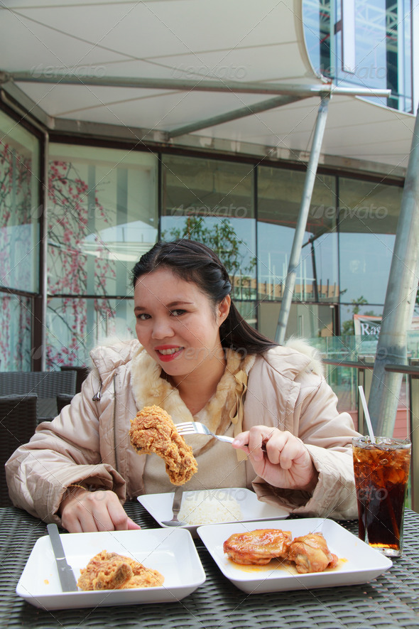 Woman Eating Chicken