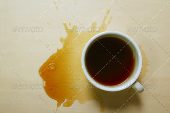 Top view of coffee cup and stains on wooden board
