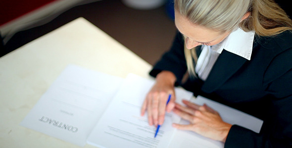 Business Woman Going Through A Contract Business Woman Going Through A Contract