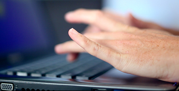 Office Girl Typing on a Laptop Computer Office Girl Typing on a Laptop Computer