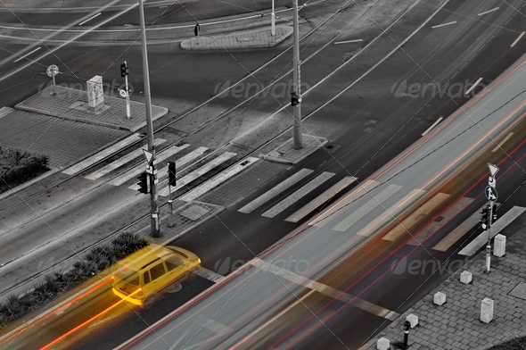Yellow car stops at crossing