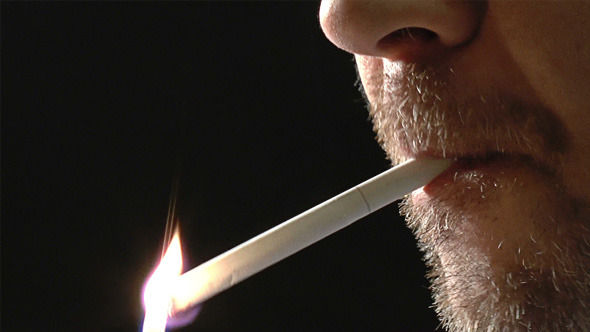 Unshaved Face of Man Smoking Cigarette Unshaved Face of Man Smoking Cigarette