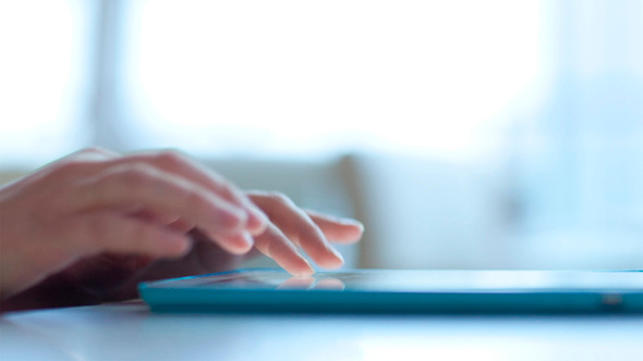 Woman Typing on Touchpad Woman Typing on Touchpad