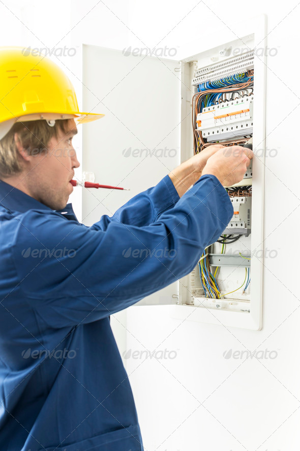 Electrician repairing fuses