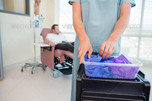 Detail of Nurse Taking Gloves in Chemo Department (Misc) Photo Download