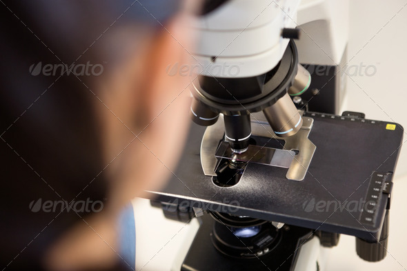 Scientist Using Microscope In Laboratory (Misc) Photo Download