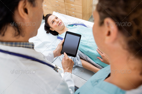 Medical Team With Patient In Hospital Room (Misc) Photo Download