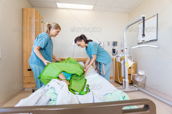 Nurses Preparing Patient Before Transferring Him On Hydraulic Li (Misc) Photo Download