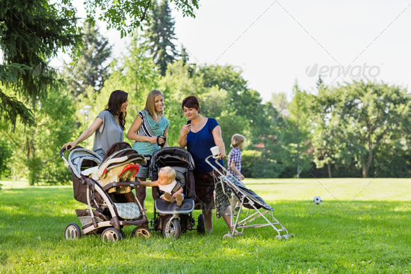 Mothers With Baby Strollers Reading Text Message