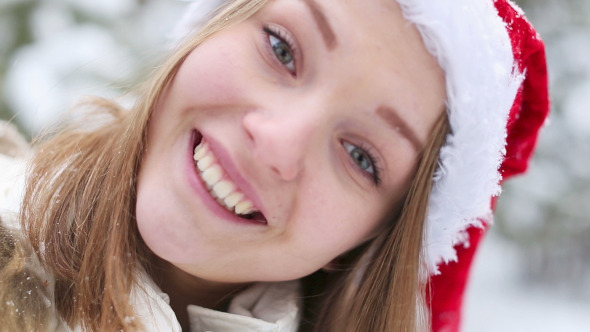 Cheerful Woman in Cap of Santa Claus Cheerful Woman in Cap of Santa Claus