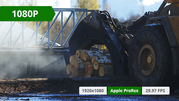 Tractor Dropping Wood In Acid Tractor Dropping Wood In Acid