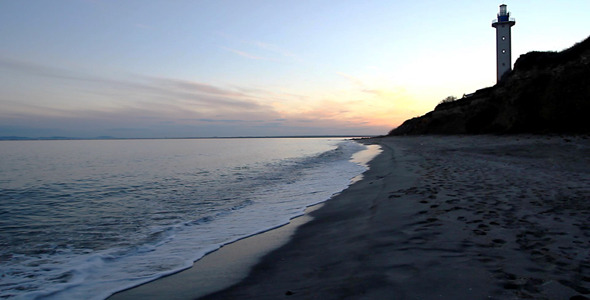 Sunset On Rocky Beach And Lighthouse Sunset On Rocky Beach And Lighthouse