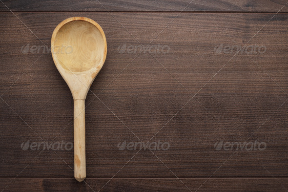 Wooden Spoon On The Blue Table