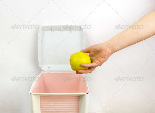throwing food at garbage