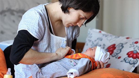 Mother Prepares to Feed Baby Mother Prepares to Feed Baby
