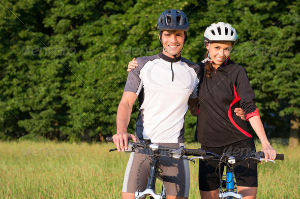 Young Sportive Couple On Bicycle