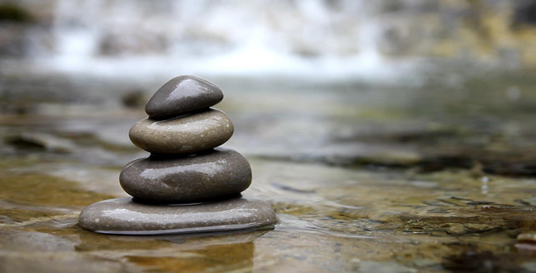 Stacked Pebbles And Flowing River Stacked Pebbles And Flowing River