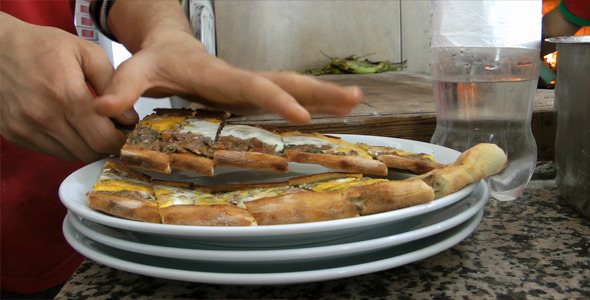 Adding Turkish Meat Pita to Plate Adding Turkish Meat Pita to Plate