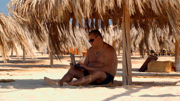 Relaxing on Beach With Laptop Relaxing on Beach With Laptop