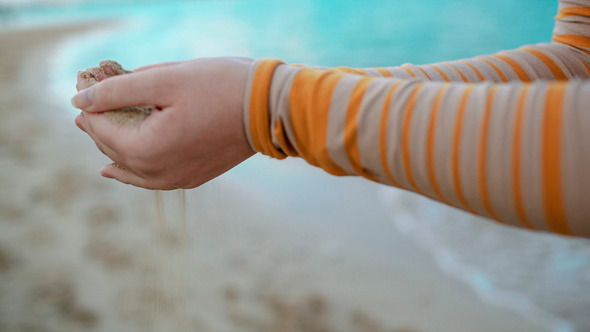 Sand Pouring Out Of Female Hands Sand Pouring Out Of Female Hands