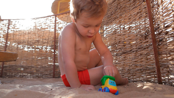 Child Playing on Beach Child Playing on Beach