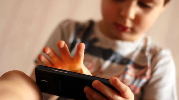 Portrait of A Child Playing with A Smartphone Portrait of A Child Playing with A Smartphone