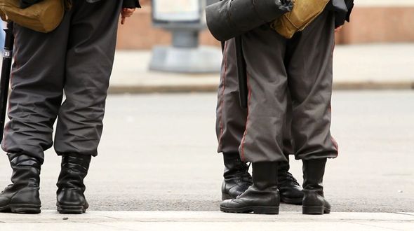 Police Cordon Legs At Meeting in Russia Police Cordon Legs At Meeting in Russia