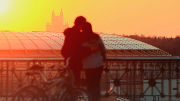 Young Couple At Sunset In the City Young Couple At Sunset In the City
