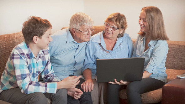 Teenager Explains How To Use a Laptop to an Elderly Person Teenager Explains How To Use a Laptop to an Elderly Person