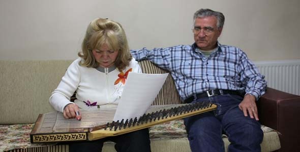 Woman Playing Qanun While Husband Listening Woman Playing Qanun While Husband Listening