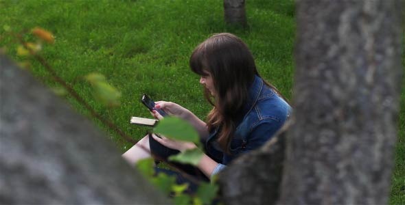 Girl With Mobile Phone In The Garden 1 Girl With Mobile Phone In The Garden 1