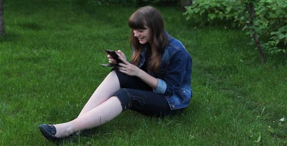 Girl With Mobile Phone In The Garden 2 Girl With Mobile Phone In The Garden 2