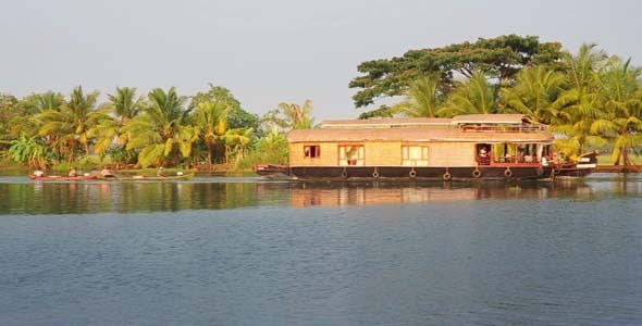House Boat Moored Alongside Canal In Kerala House Boat Moored Alongside Canal In Kerala