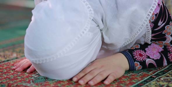Young Muslim Girl Reading Quran In Mosque Young Muslim Girl Reading Quran In Mosque