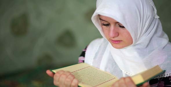 Muslim Girl Praying In Small Graveyard Muslim Girl Praying In Small Graveyard