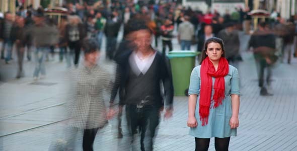 Young Woman Standing In Busy City Street Young Woman Standing In Busy City Street