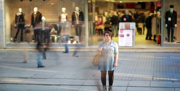 Young Woman Posing In Front Of Shopping Mall Young Woman Posing In Front Of Shopping Mall
