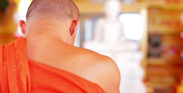Buddhist Monk With Orange Robe Pray in Temple Buddhist Monk With Orange Robe Pray in Temple