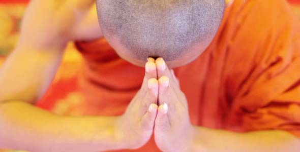 Buddhist Monk With Orange Robe Pray in Temple Buddhist Monk With Orange Robe Pray in Temple