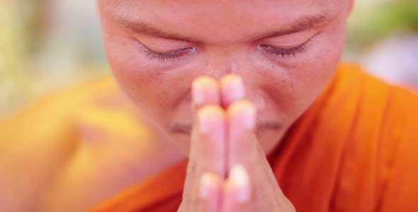Buddhist Monk With Orange Robe Pray in Temple Buddhist Monk With Orange Robe Pray in Temple