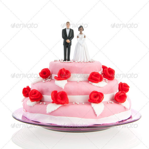 mixed couple on top of wedding cake