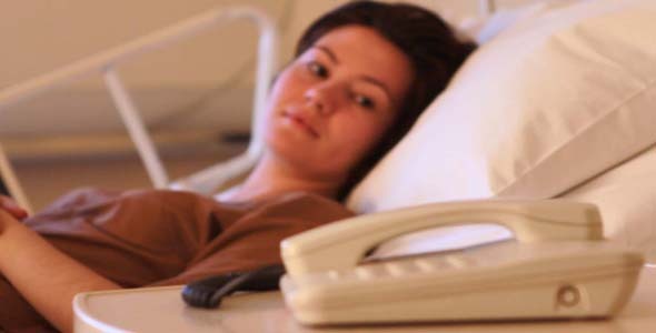 Patient Looking At The Phone Patient Looking At The Phone