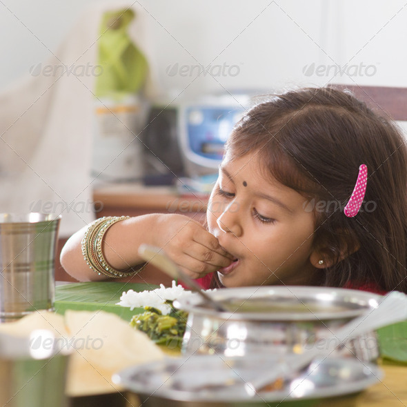 Indian girl eating rice