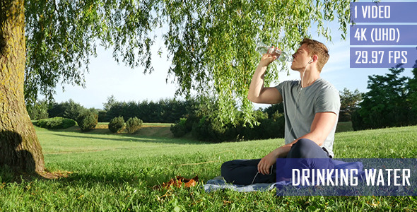 Healthy Man Drinks Water In The Park Healthy Man Drinks Water In The Park
